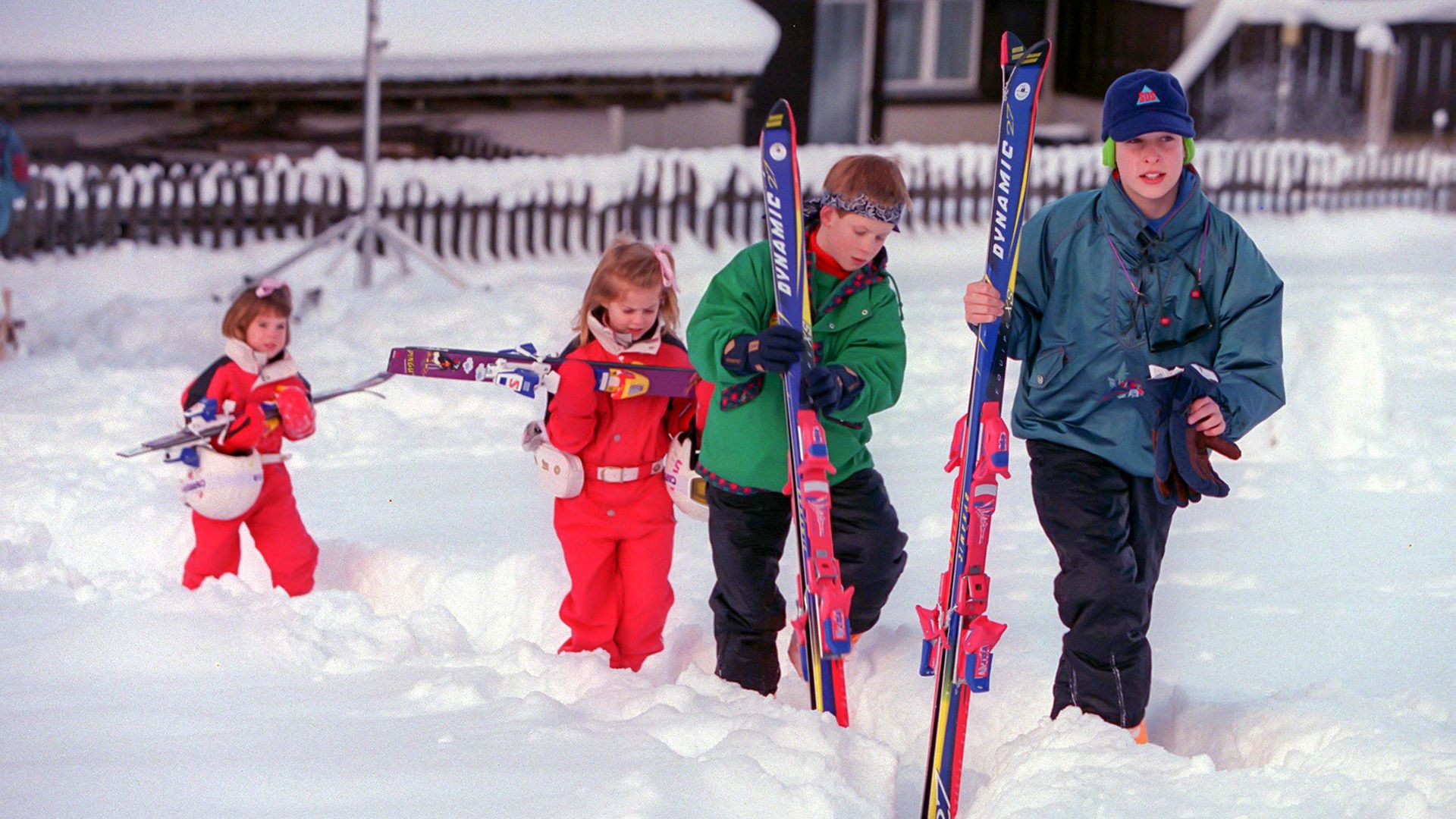 A young Prince William and Prince Harry with Princess Beatrice and Princess Eugenie on a skiing holiday