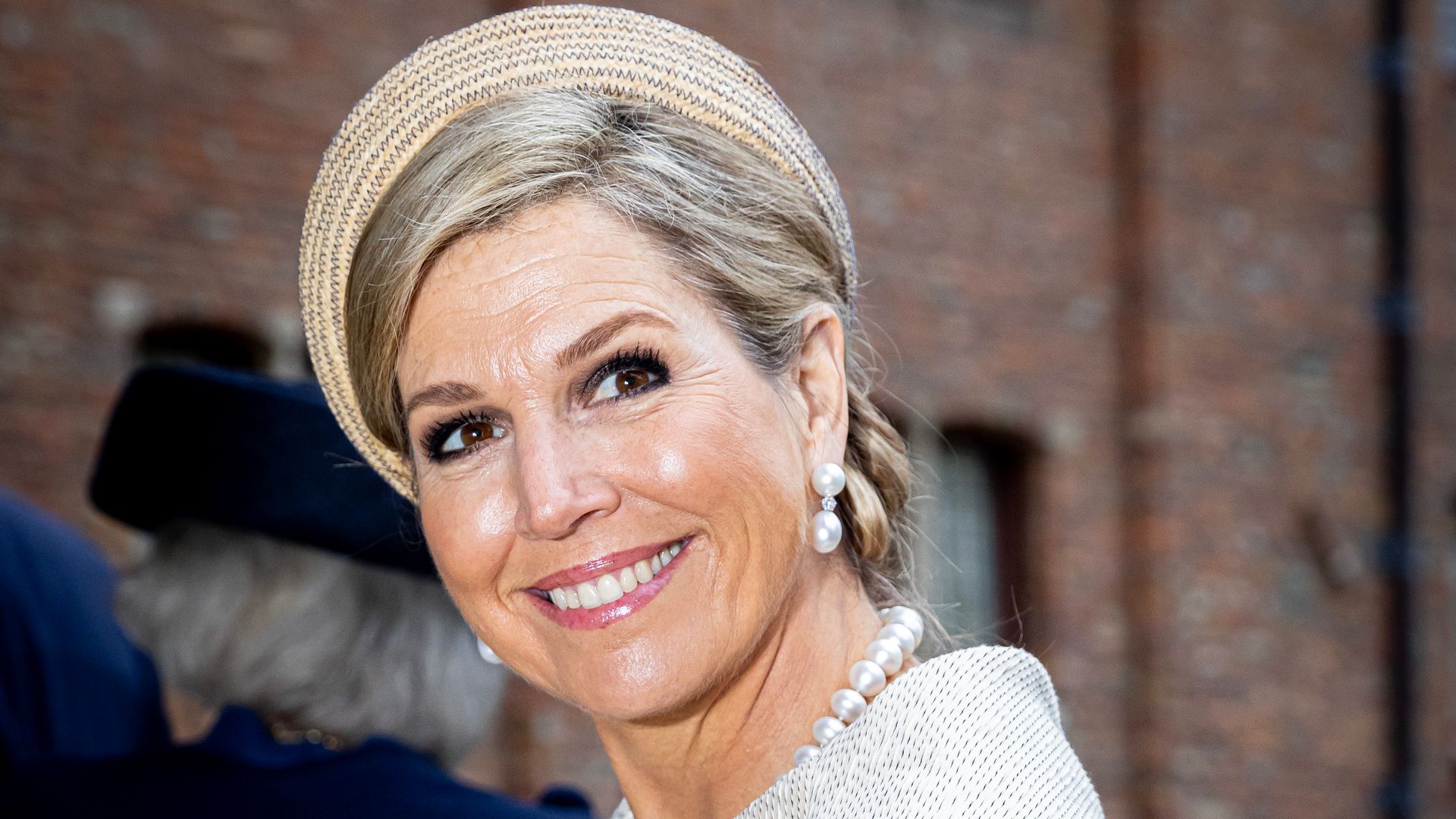 Queen Maxima in ivory jacket and headband