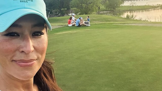 Joanna Gaines smiling golf course, baseball cap