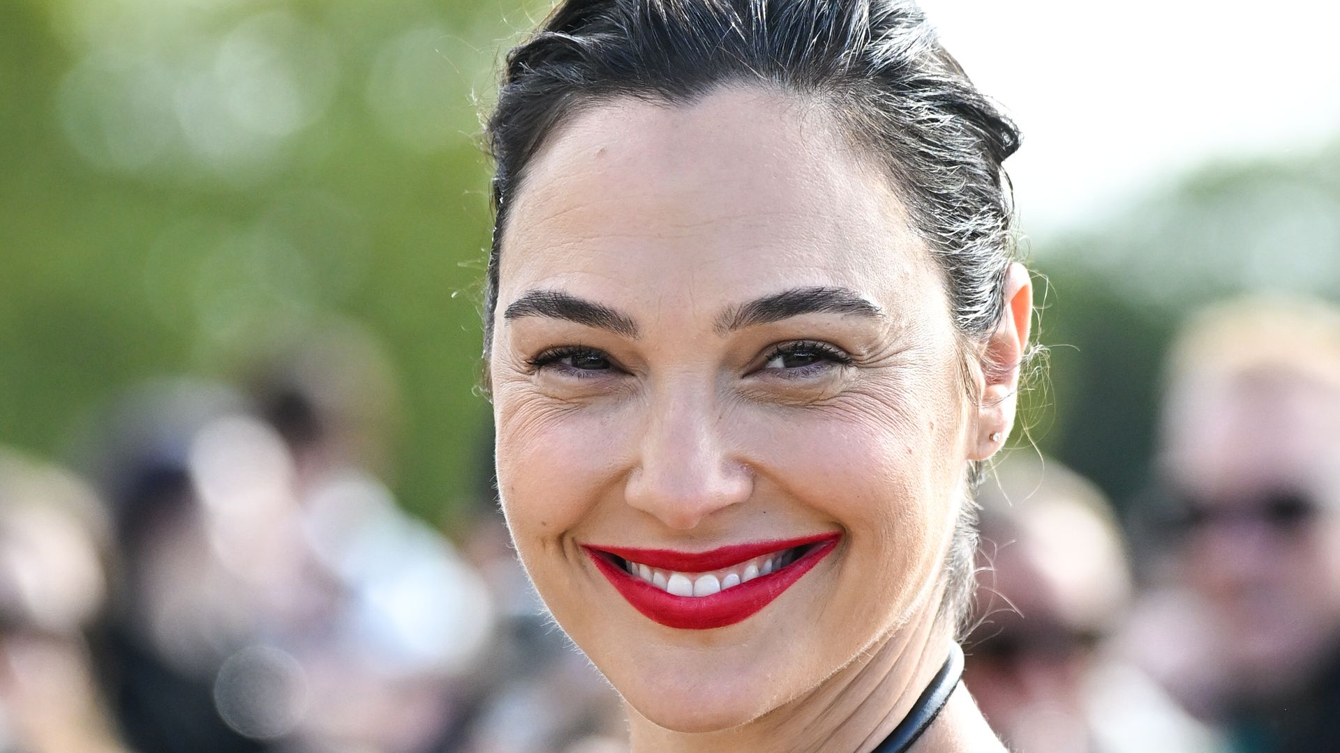 Gal Gadot looks phenomenal in plunging leather dress during Paris Fashion Week