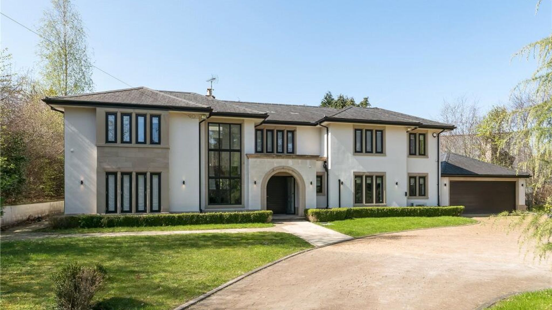 The exterior of a house - its walls are white