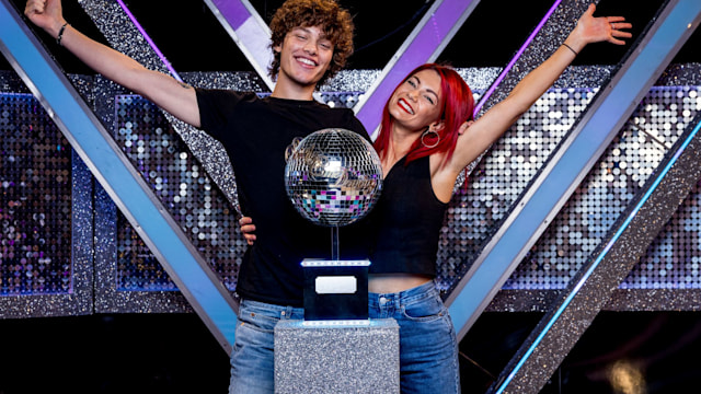 Bobby Brazier and Dianne Buswell lift the Glitterball trophy