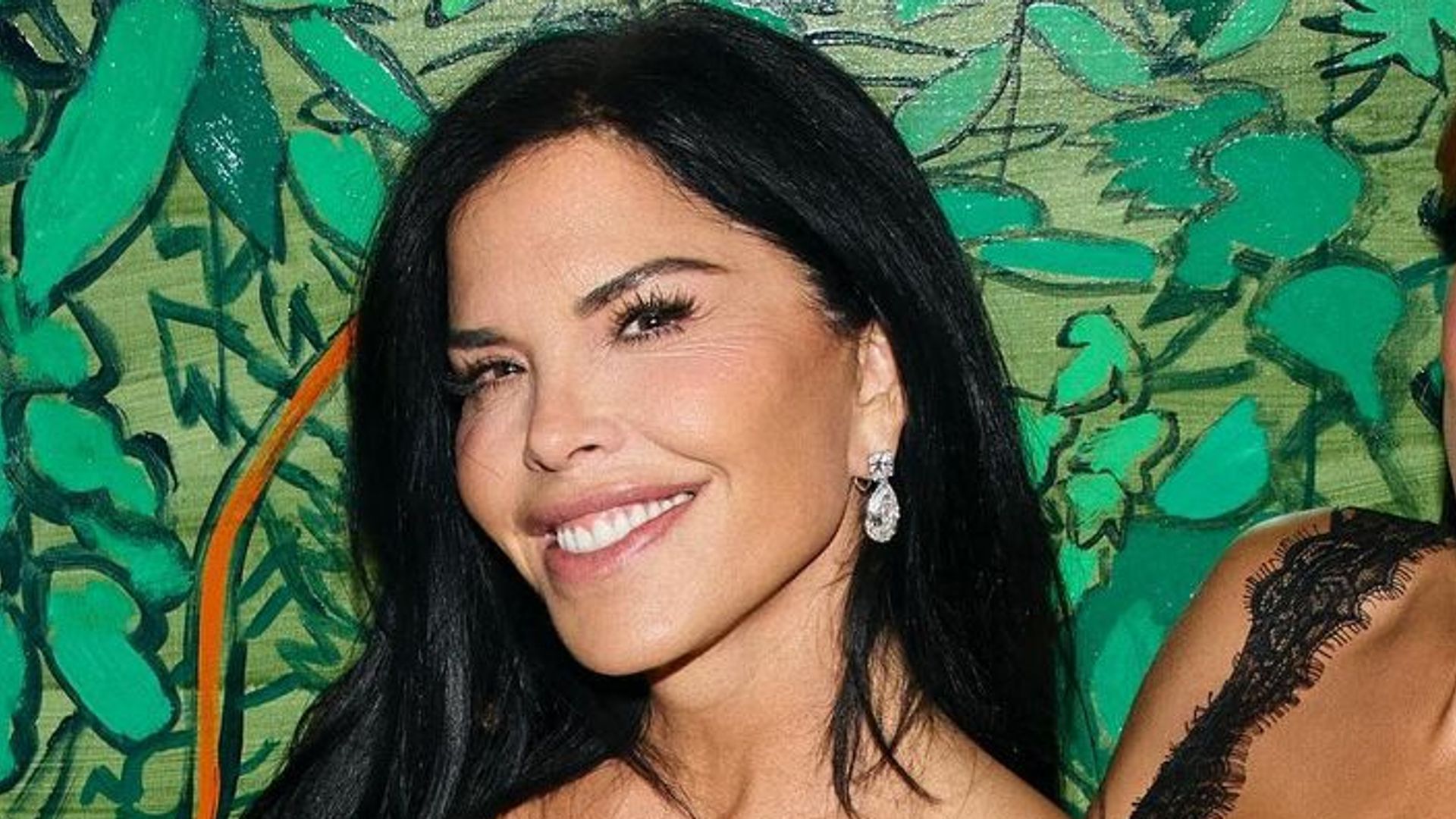 Lauren Sanchez, 54, turns up the heat in fire-red minidress made of a very unusual fabric