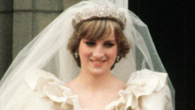 Prince Charles holding his bride Princess Diana's hand on the balcony at Buckingham Palace