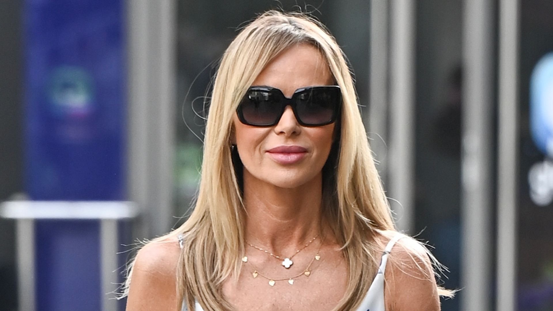 Amanda Holden sizzles as she displays toned legs in tiny mini dress