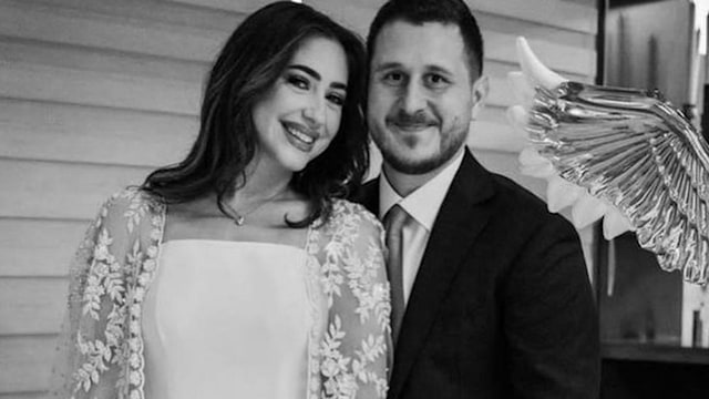 Aoun Juma in a suit with his new fiancee Lena bint Wail Abbas in a caped dress