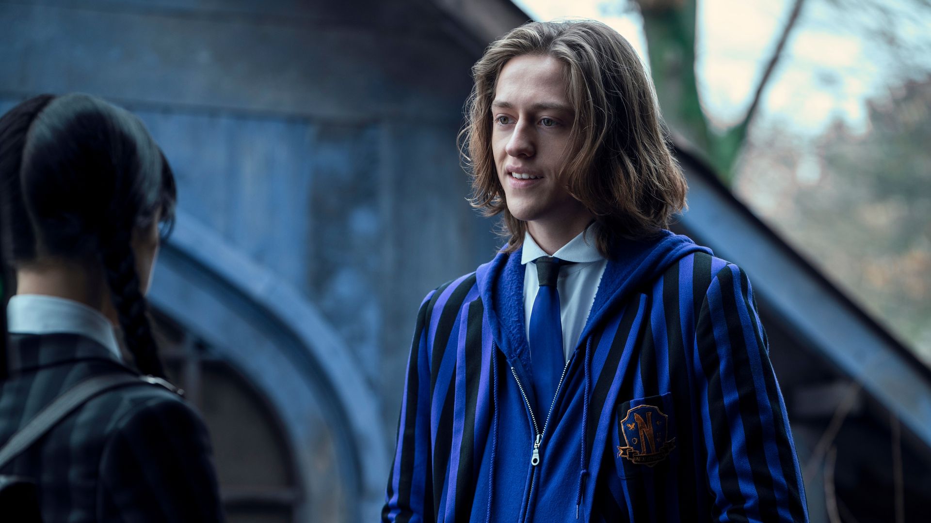 teenage boy with blonde hair in purple blazer