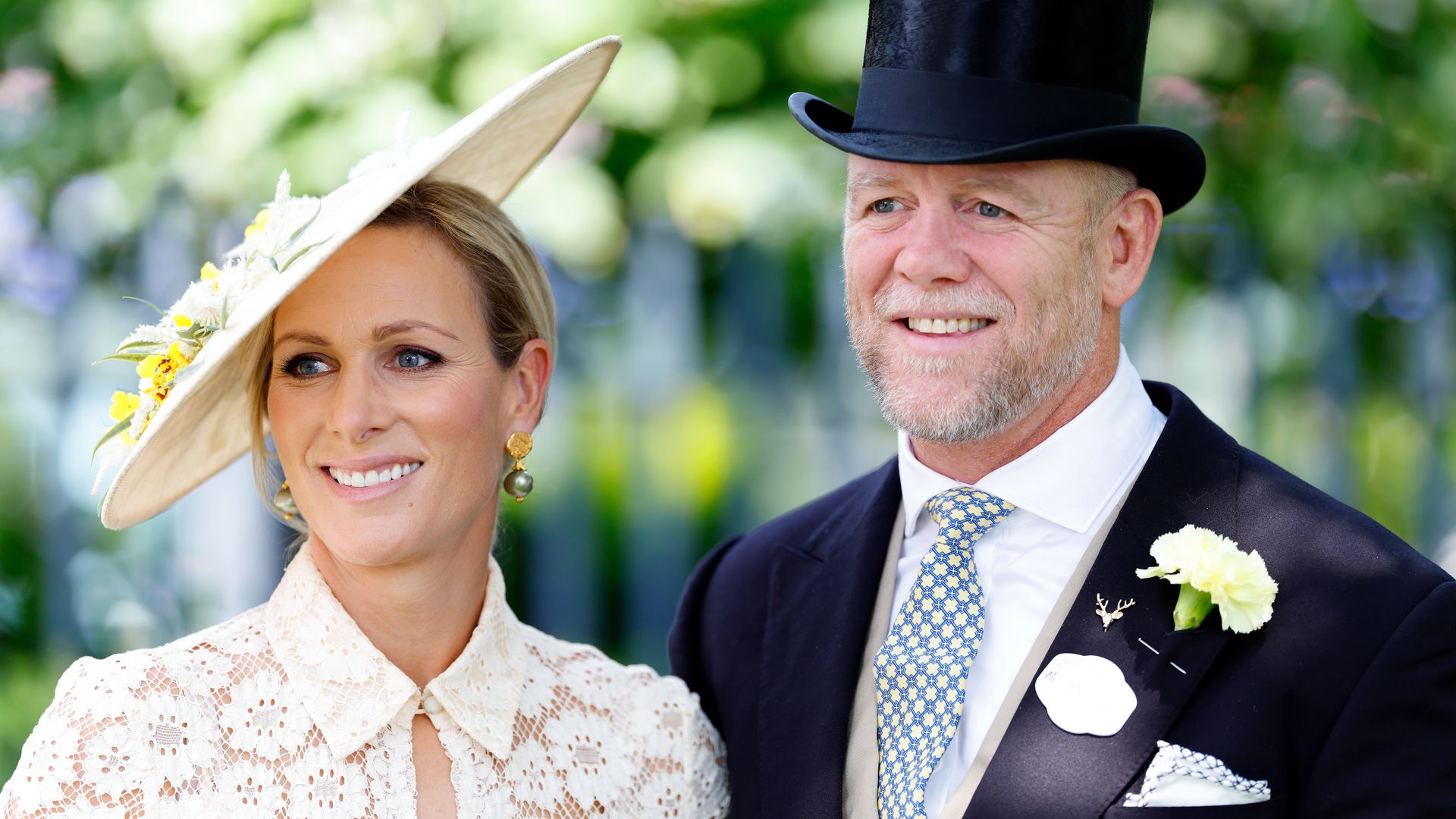 Zara Tindall in white and Mike Tindall in suit and top hat