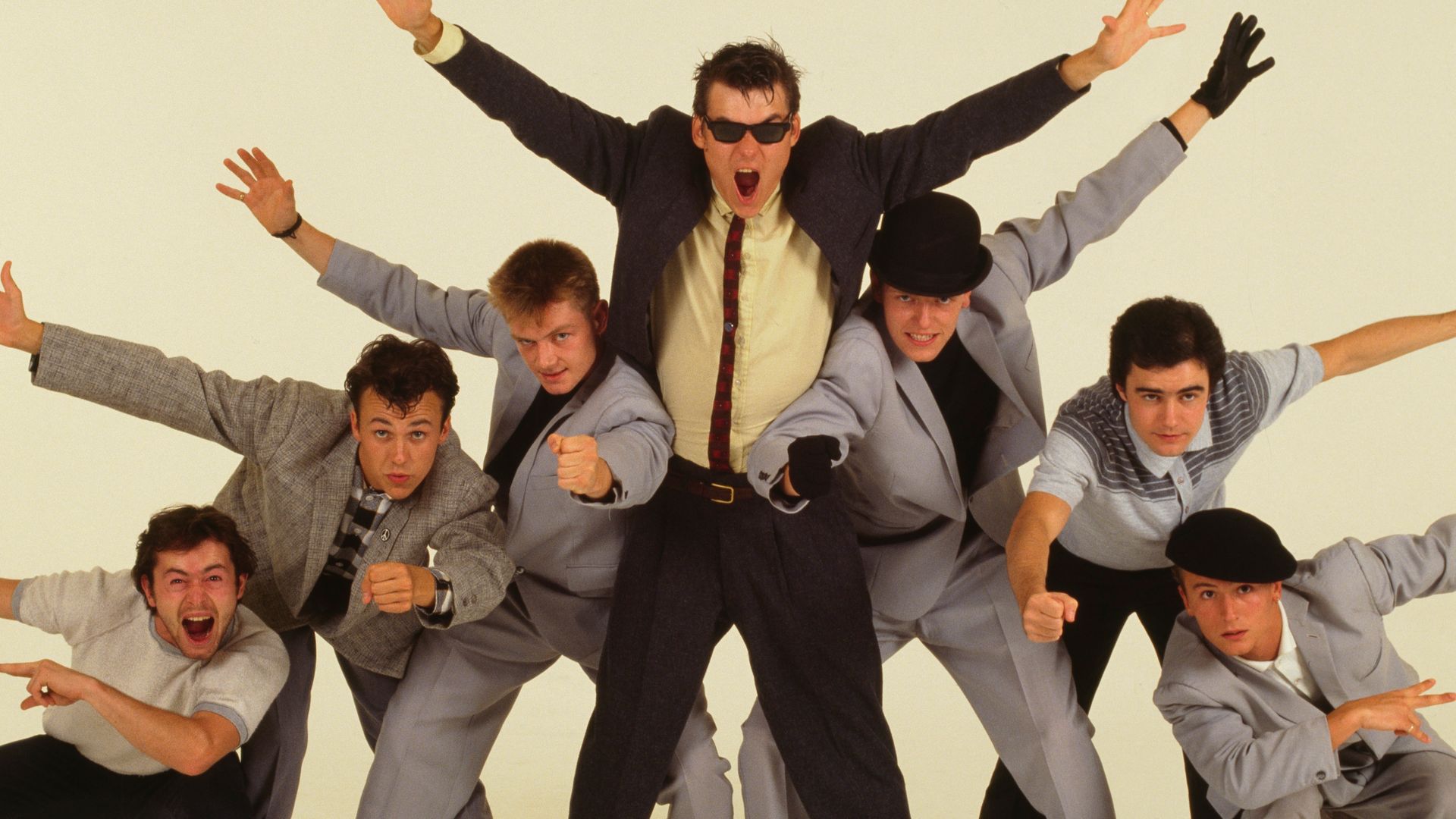 English pop/ska band Madness in London, 1981. This was the image used on the cover of '7', the group's third album. Left to right: Lee Thompson, Mark Bedford, Chas Smash, Mike Barson, Suggs, Chris Foreman and Dan Woodgate. (Photo by Michael Putland/Getty Images)