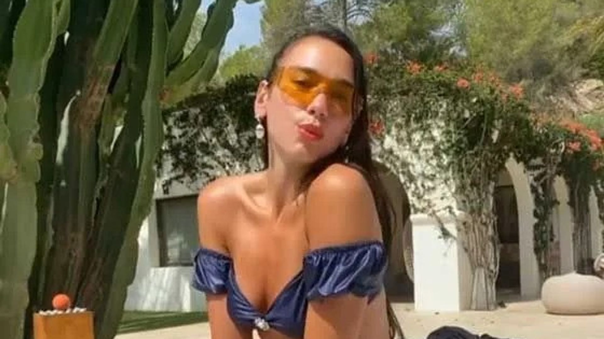 Dua Lipa twins with her sister Rina in Spain rocking matching string bikinis