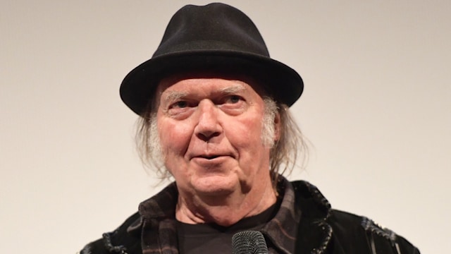 neil young holding microphone