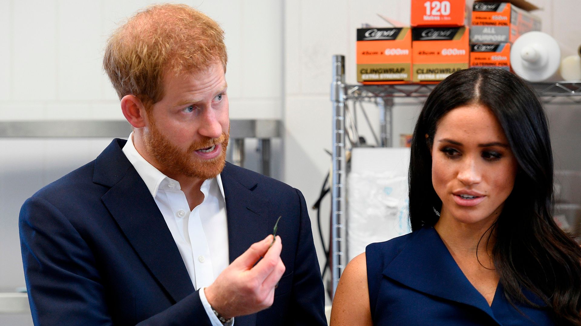 Britain's Prince Harry and and his wife Meghan, Duchess of Sussex sample ingredients used in native food at the Charcoal Lane Mission Australia social enterprise restaurant in Melbourne on October 18, 2018. - Chargrilled kangaroo was on the royal menu on October 18 as Prince Harry and his pregnant wife Meghan arrived in Australia's second-largest city Melbourne, where they were greeted by thousands of screaming fans. (Photo by ANDY BROWNBILL / POOL / AFP) (Photo credit should read ANDY BROWNBILL/AFP via Getty Images)