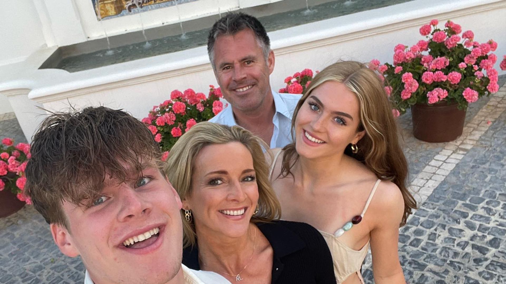 Gabby Logan with two children and husband on holiday