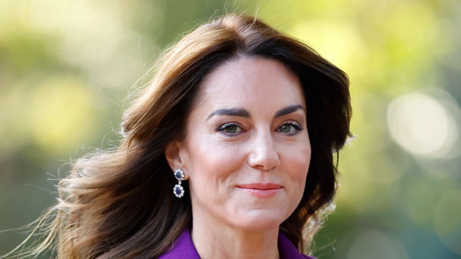 Kate Middleton in a purple outfit