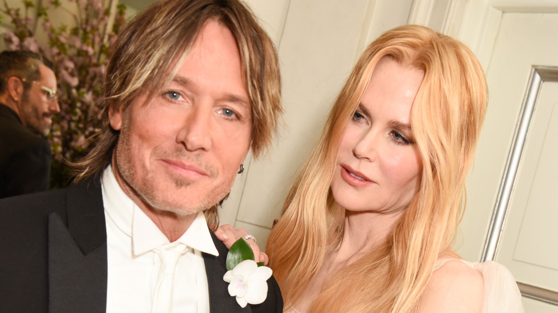 Keith Urban In a suit and Nicole Kidman in a sparkly nude pink dress