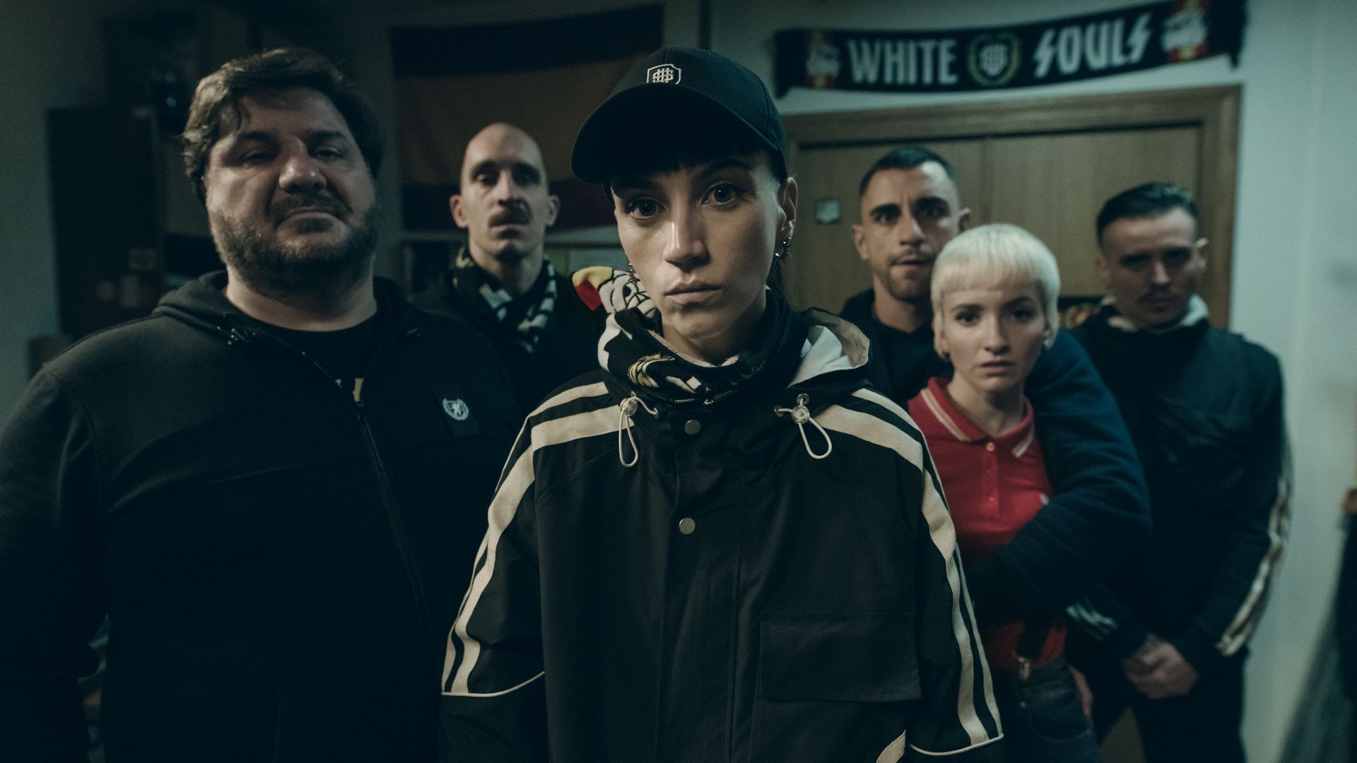 A group of characters in a still from Salvador