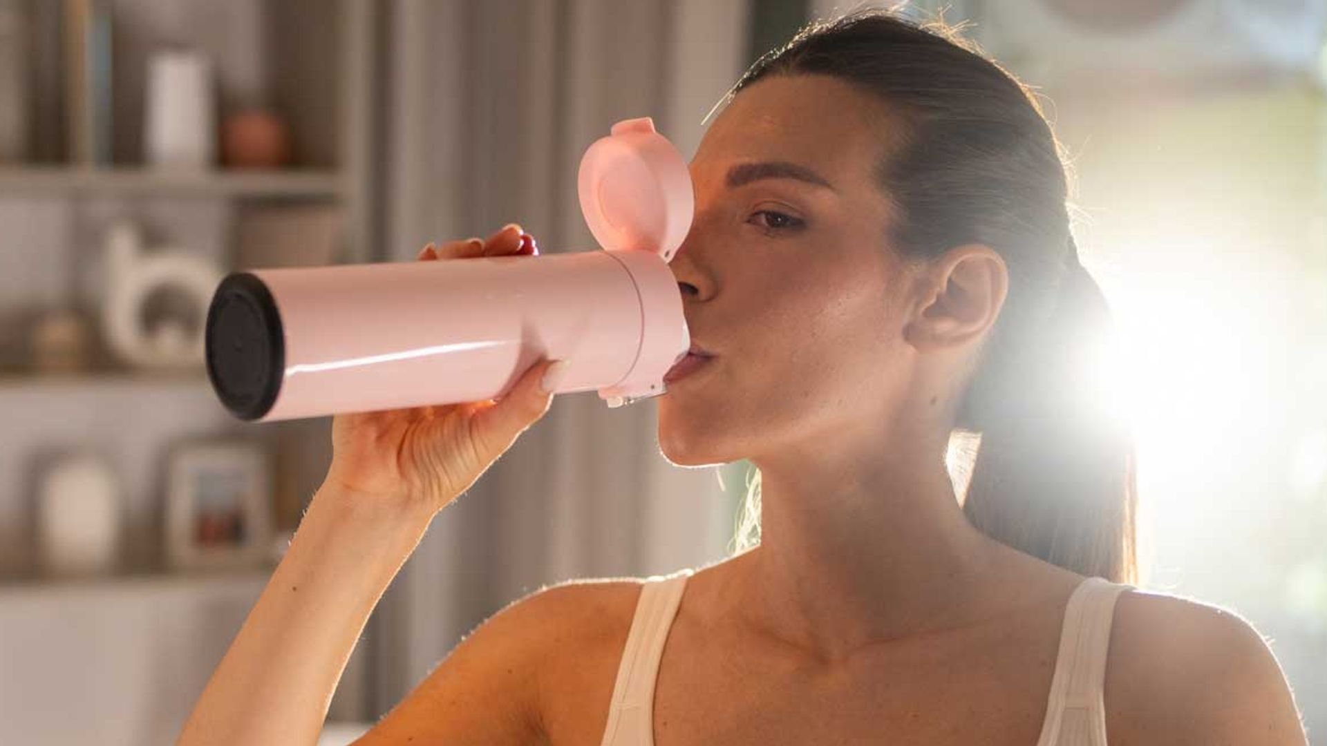 c36e8ee19711 woman drinking supp