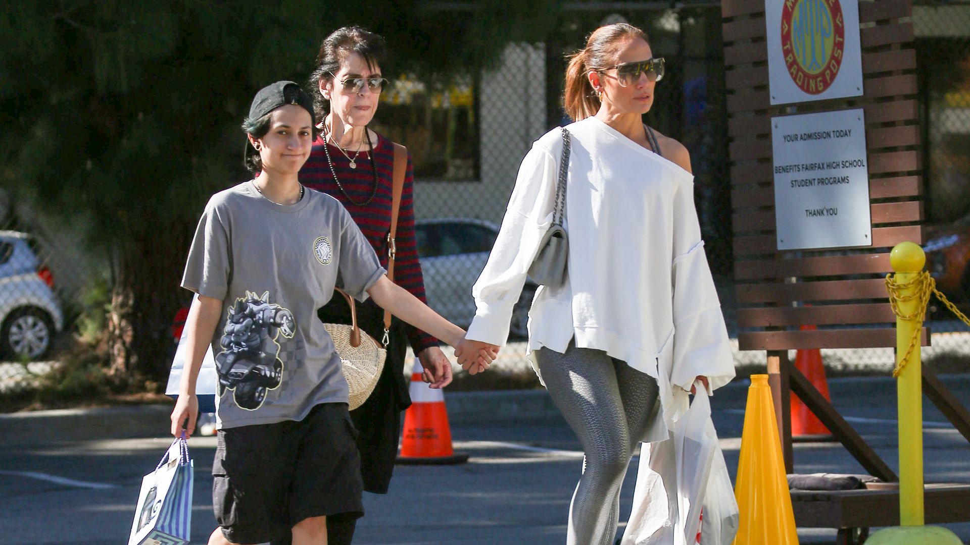 Jennifer Lopez holding hands with her child Emme Maribel Muñiz