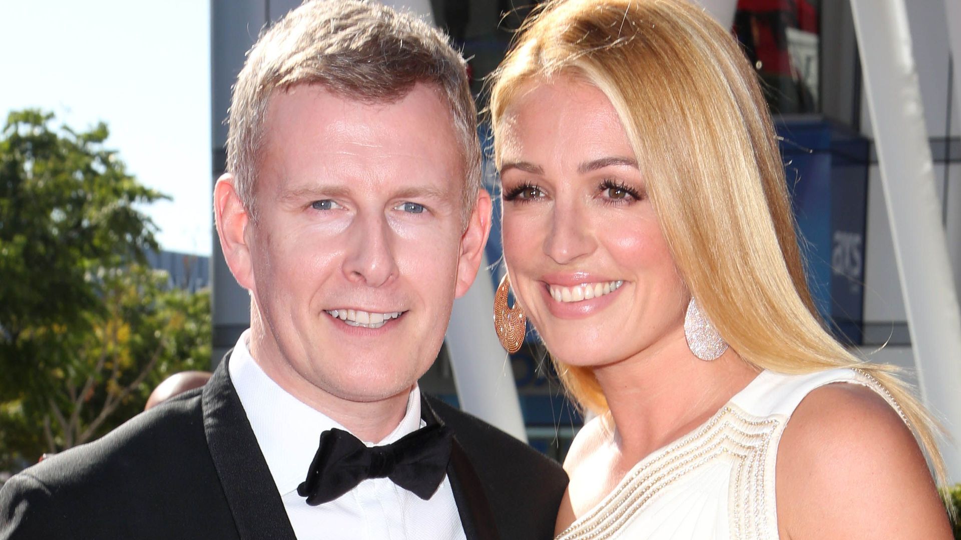 Cat Deeley in a white dress with her husband Patrick Kielty