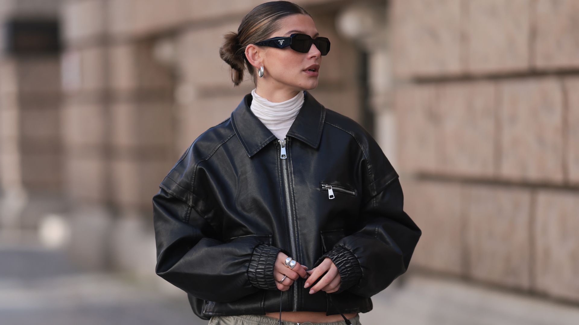 model wearing bomber jacket street style 