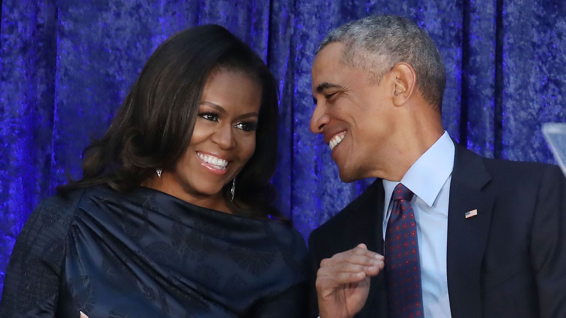 Former U.S. President Barack Obama and first lady Michelle Obama participate in the unveiling of their official portraits during a ceremony at the Smithsonian's National Portrait Gallery, on February 12, 2018 in Washington, DC. The portraits were commissioned by the Gallery, for Kehinde Wiley to create President Obama's portrait, and Amy Sherald that of Michelle Obama