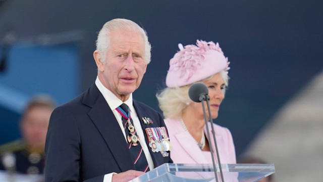 king charles and camilla on stage during D-Day anniversary ceremony 