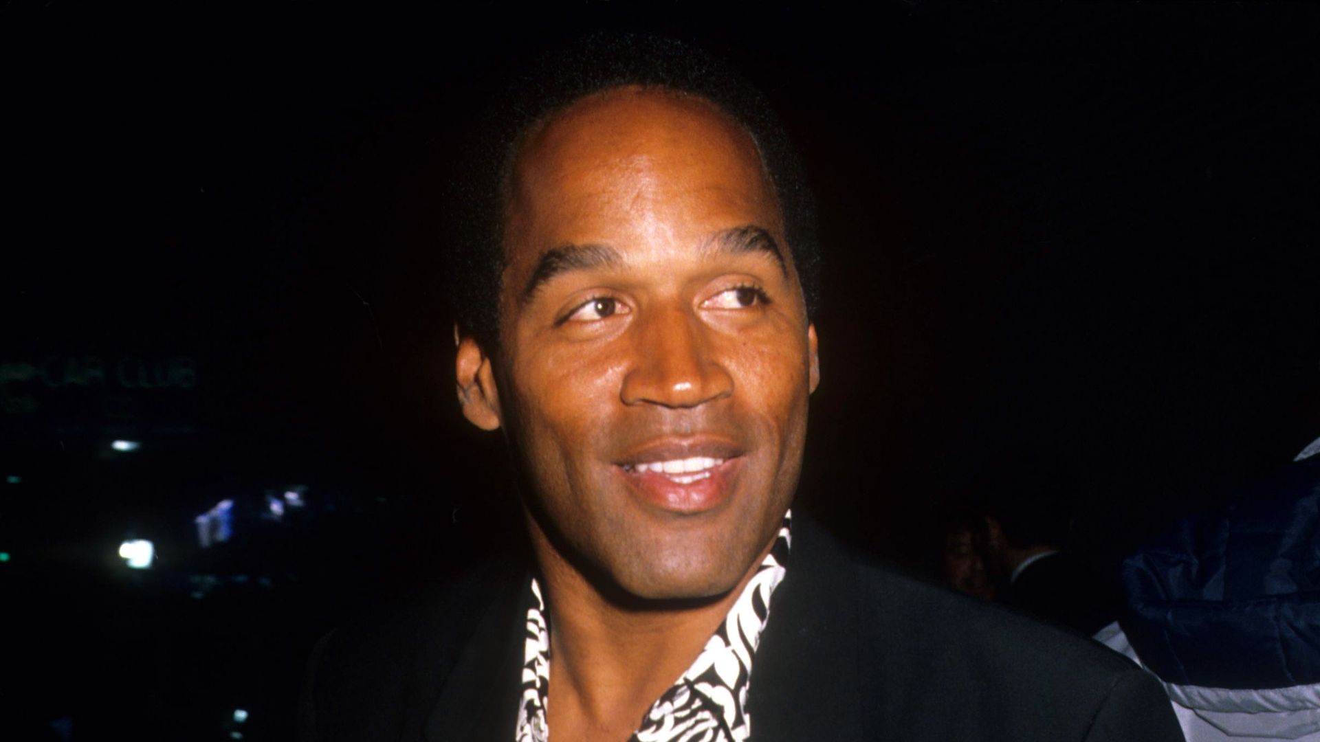 Actor and former NFL player O.J. Simpson arrives at a movie premiere circa 1990 in Los Angeles, California.