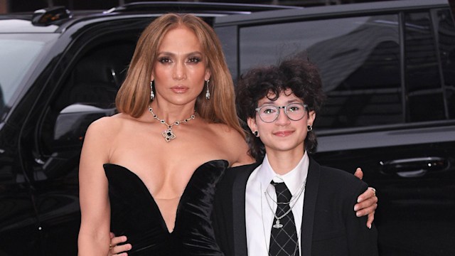 photo of jennifer lopez and child emma with their arms around each other