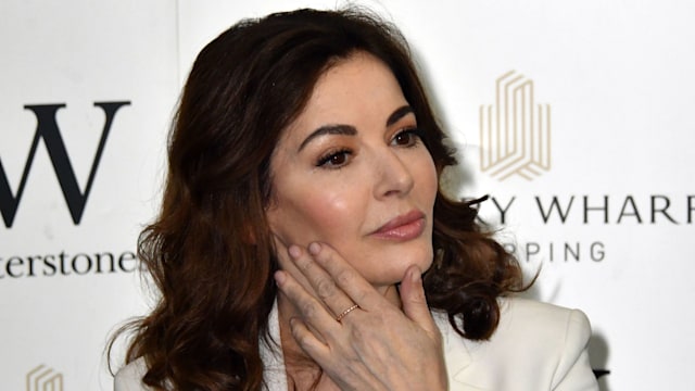 Nigella Lawson looking sad with hand to her cheek