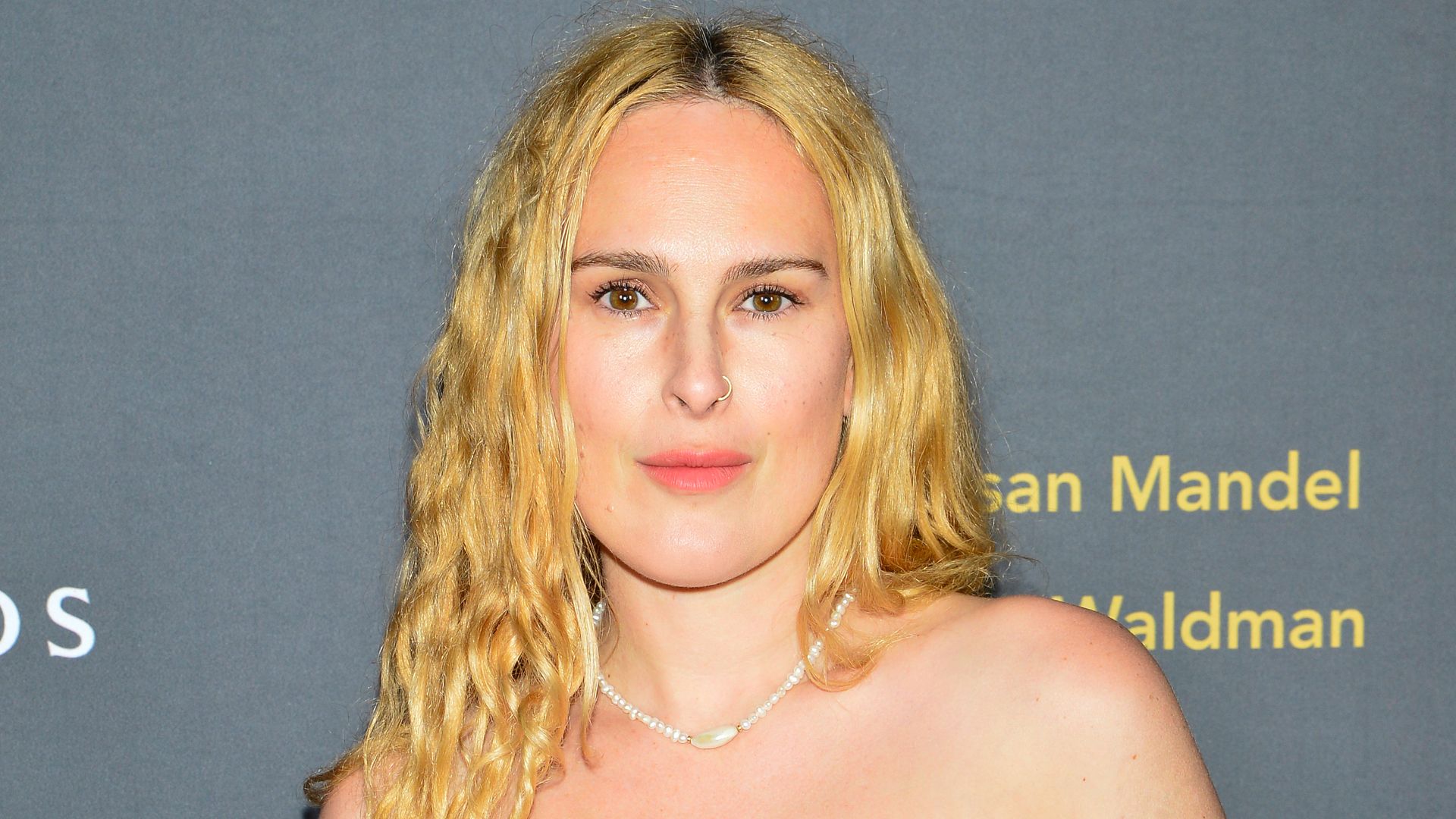 Rumer Willis stuns in thigh-split dress after embracing her 'mama curves'