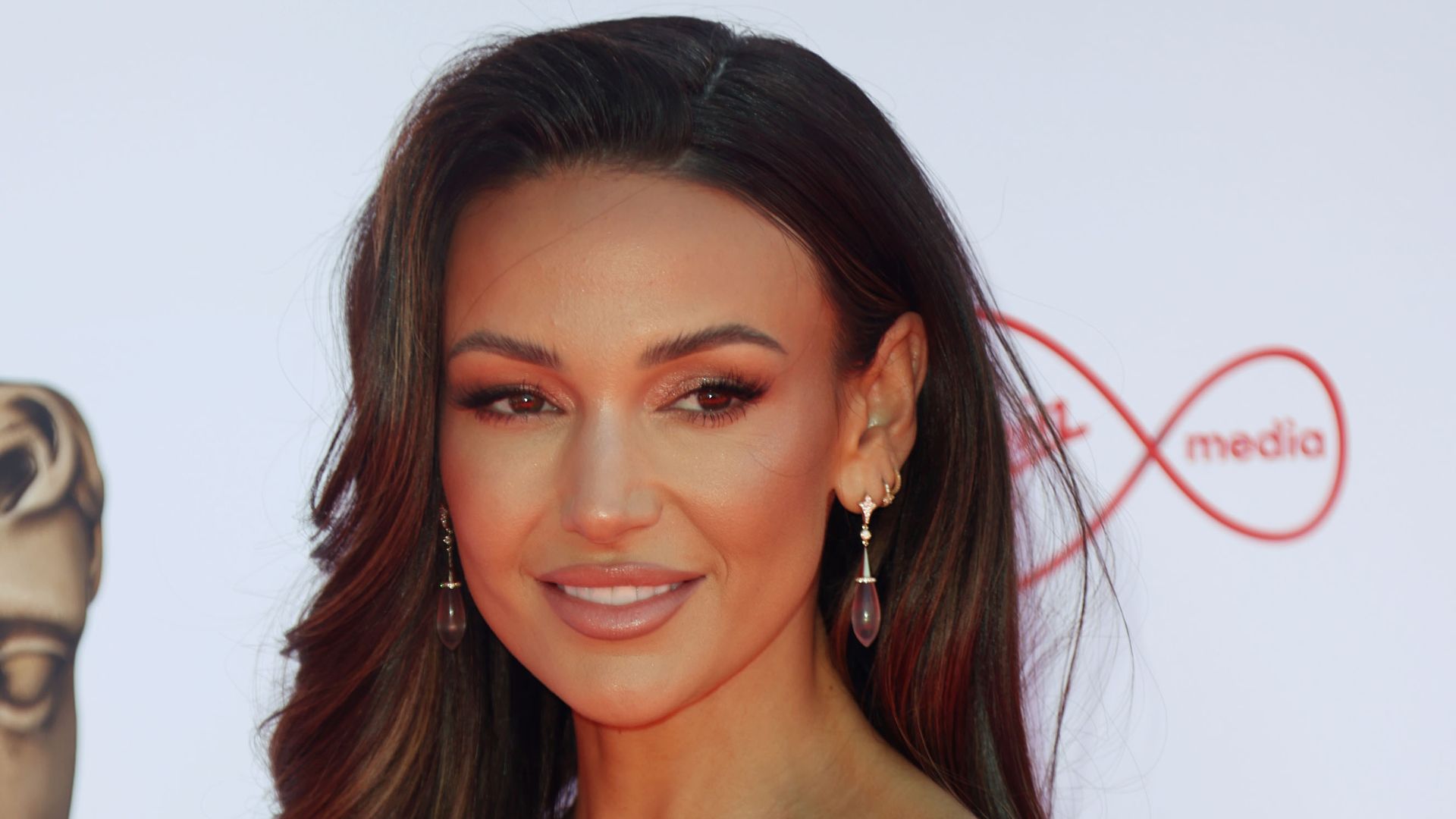 Michelle Keegan debuts new look in backless butterfly mini dress | HELLO!