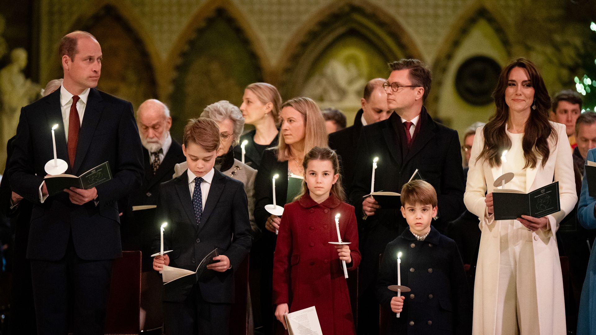 William, George, Charlotte, Louis and Kate holding candles at carol service
