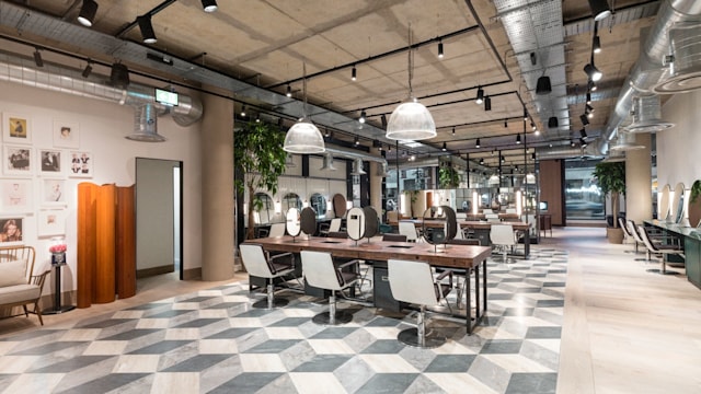 Hershesons hair salon with white chairs and geometric flooring