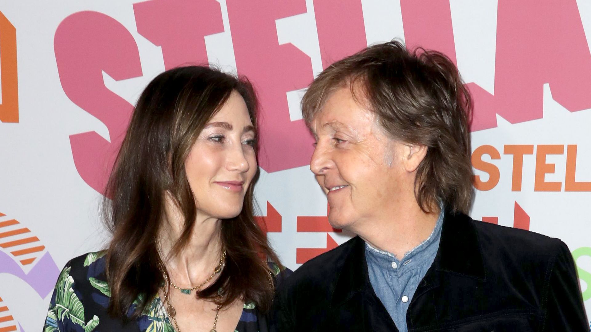 Sir Paul McCartney and wife Nancy smiling 