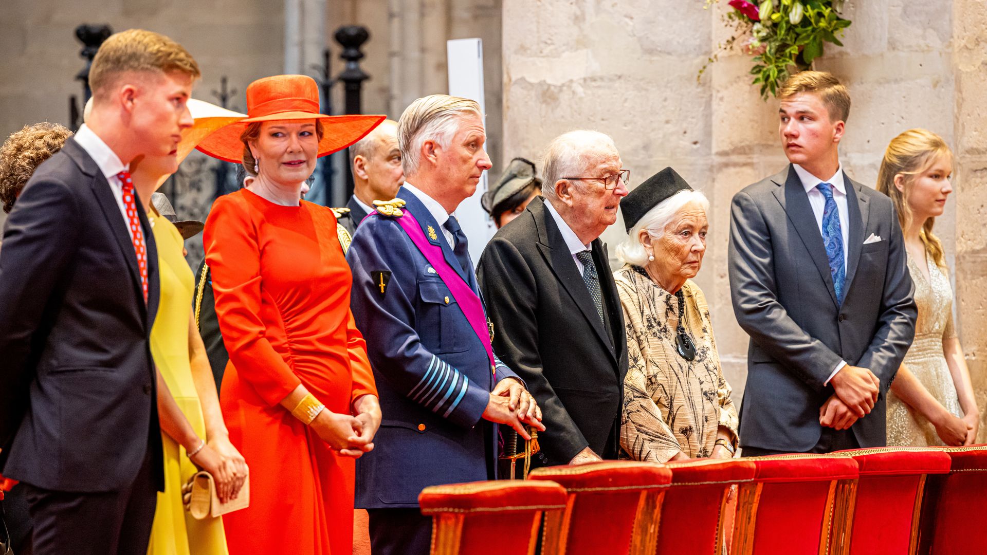 Princess Emmanuel standing with Princess Elisabeth, Queen Mathilde, King Phillipe, King Albert, Queen Paola, Prince Gabriel and princess Eleonore