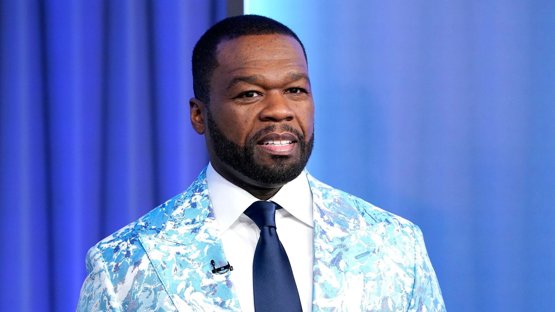 photo of 50 cent in floral jacket
