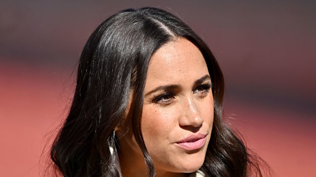 meghan markle at invictus games in white jacket 
