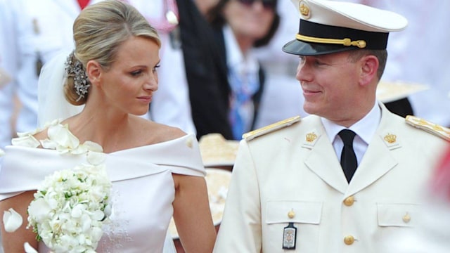 Princess Charlene looking at Prince Albert on her wedding day