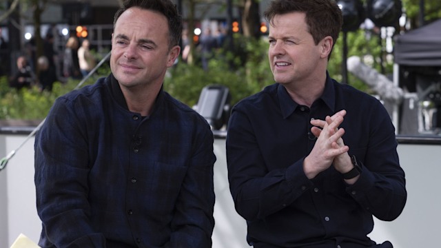 Ant and Dec sitting in dark clothes looking serious