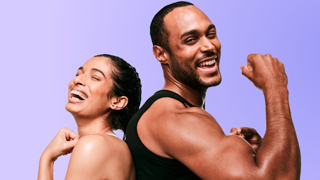 Woman and man flexing their muscles and smiling