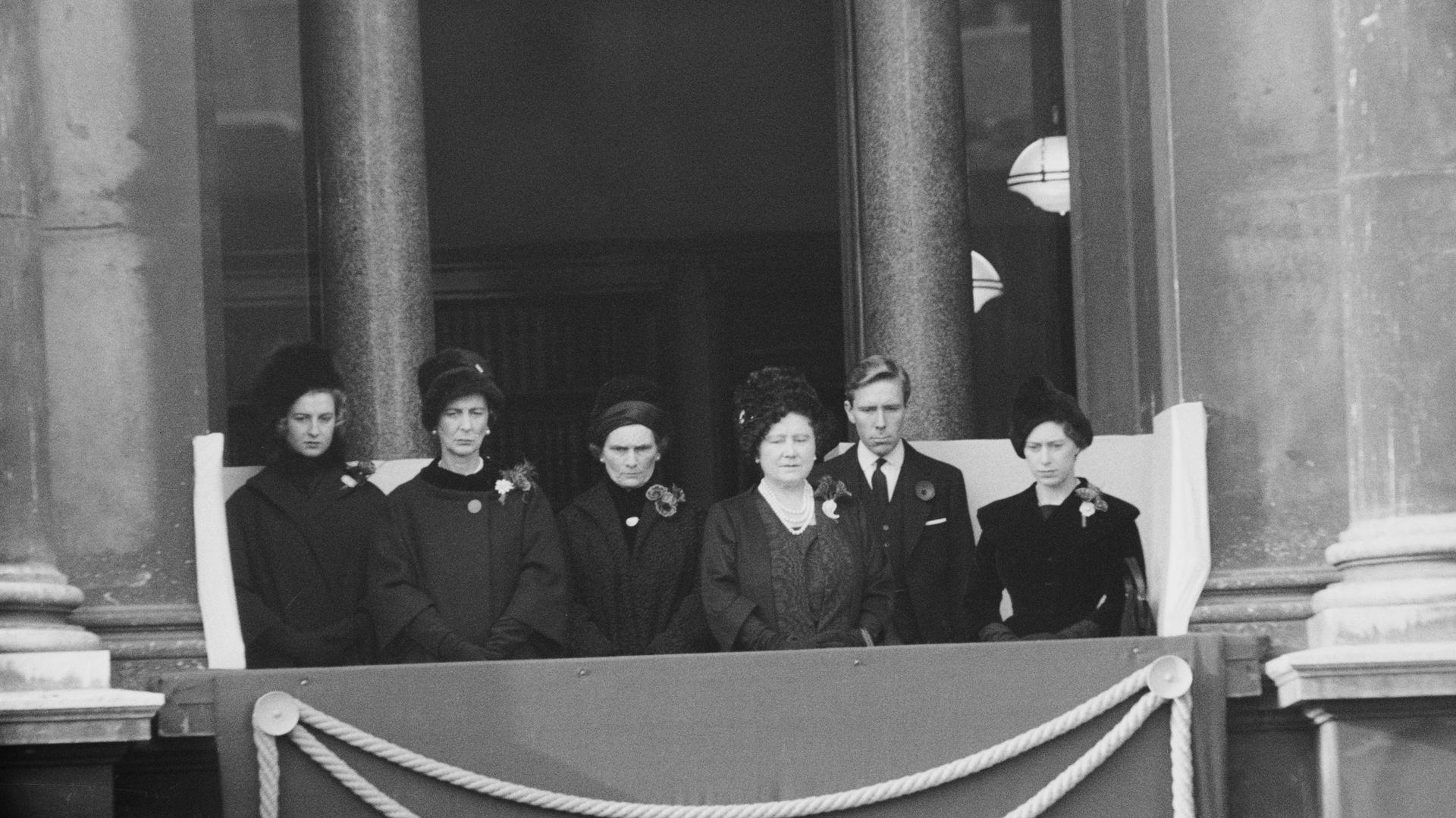 Princess Alexandra, Princess Marina, Princess Alice, the Queen Mother, Antony Armstrong-Jones and Princess Margaret in black on a balcony in Buckingham Palace