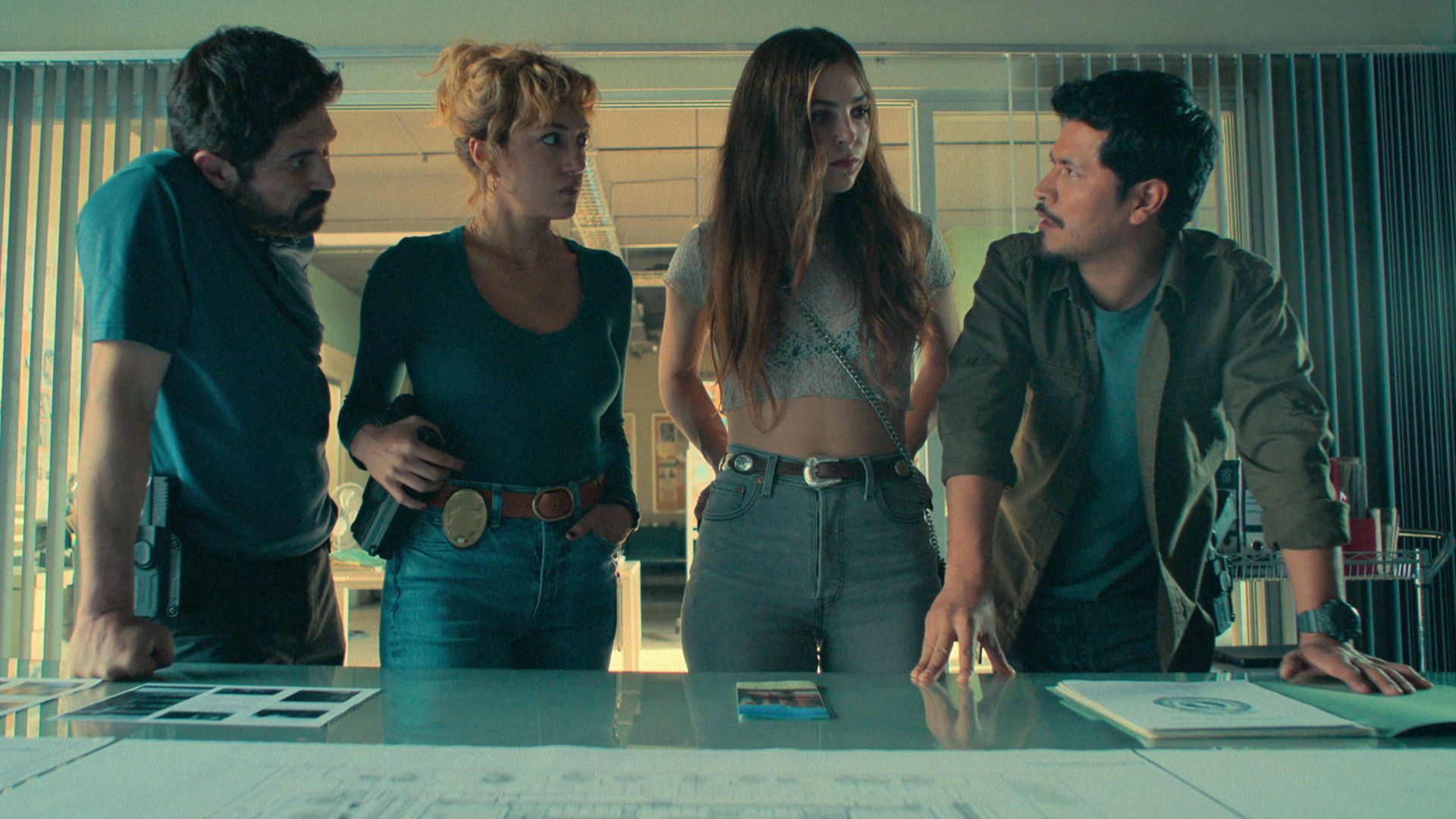 group of police officers standing over table