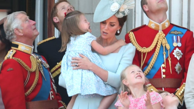 (Left to right) The Prince of Wales, Duke of Sussex, Duchess of Cambridge holding Princess Charlotte and Duke of Cambridge with Savannah Phillips and Prince George on the balcony of Buckingham Palace
