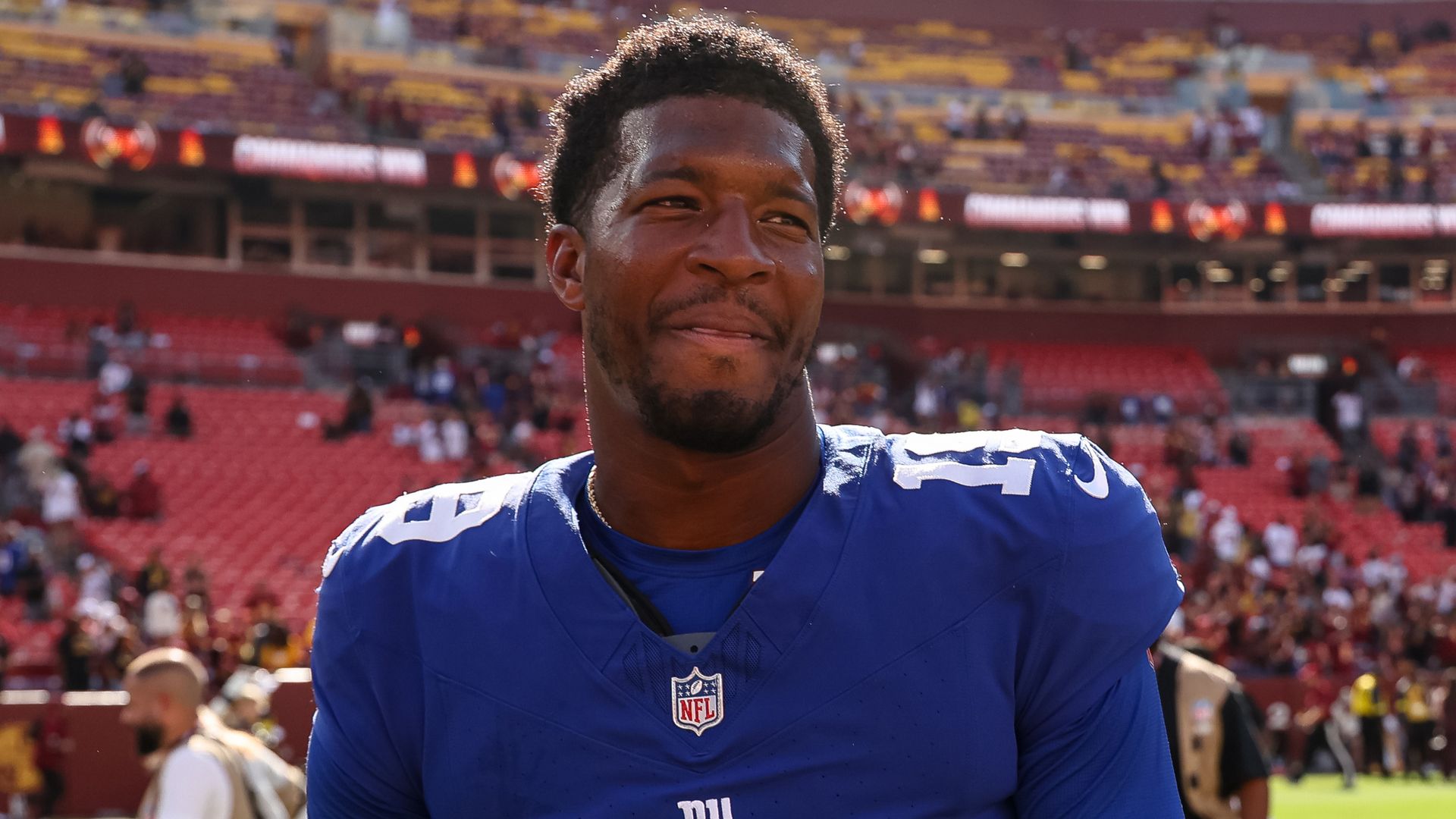 photo of jameis winston in giants jersey on the field