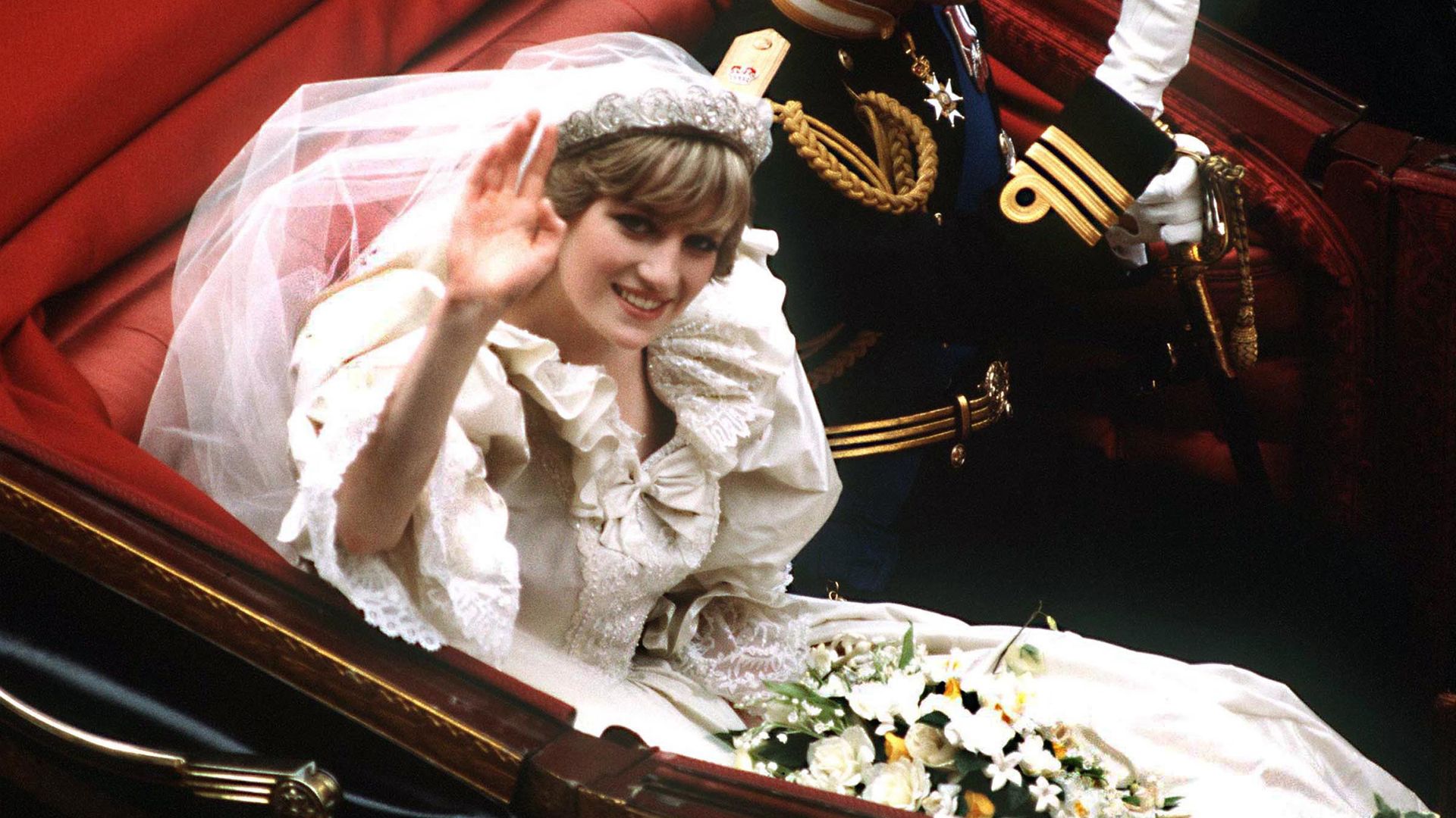 Princess Diana waves after wedding ceremony