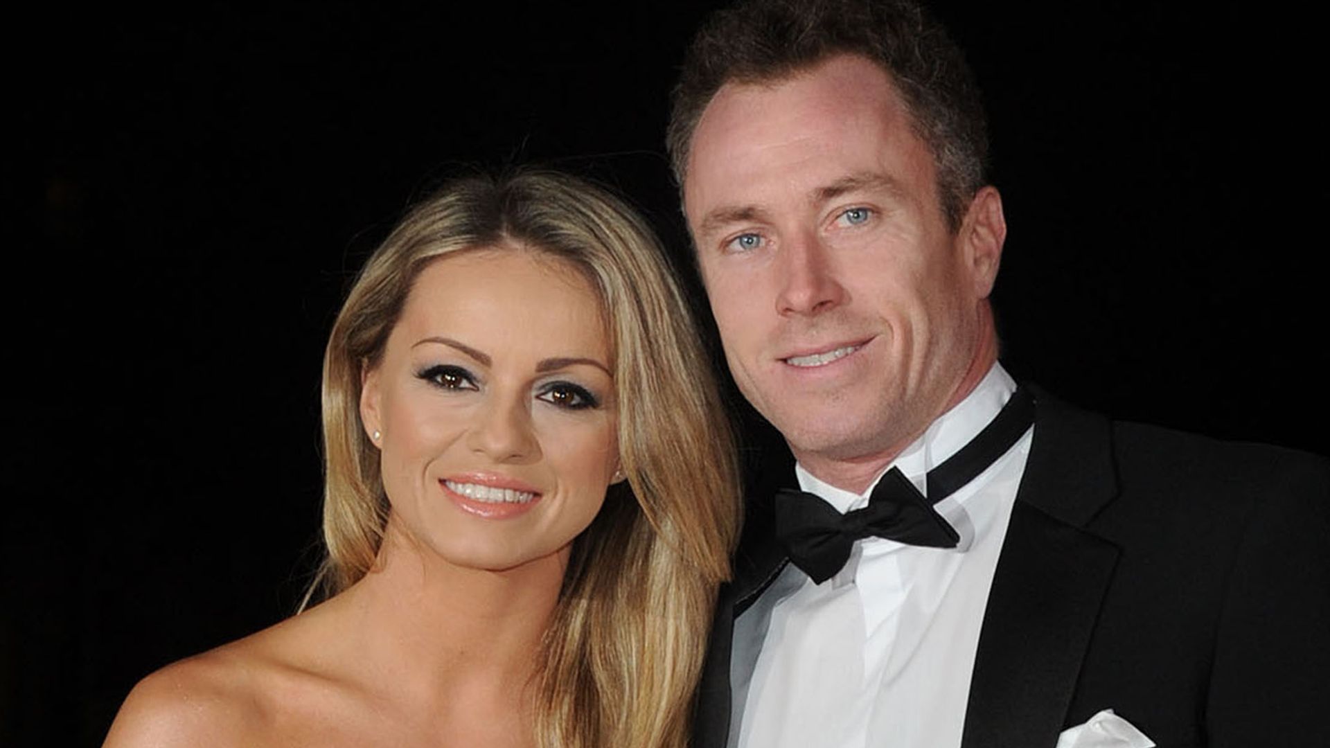 James Jordan in a black suit and Ola Jordan in a sparkly strapless dress