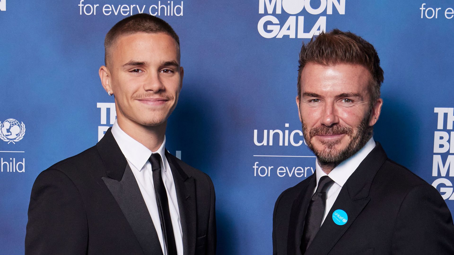 Romeo and David Beckham in suits