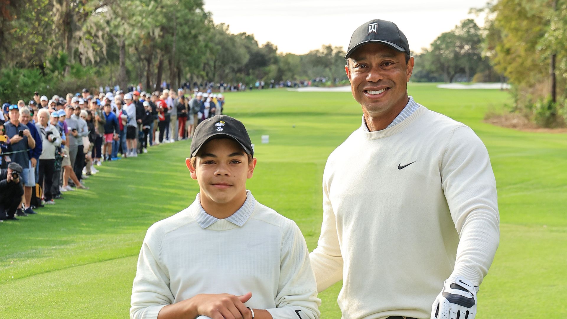 tiger woods and son charlie on golf course