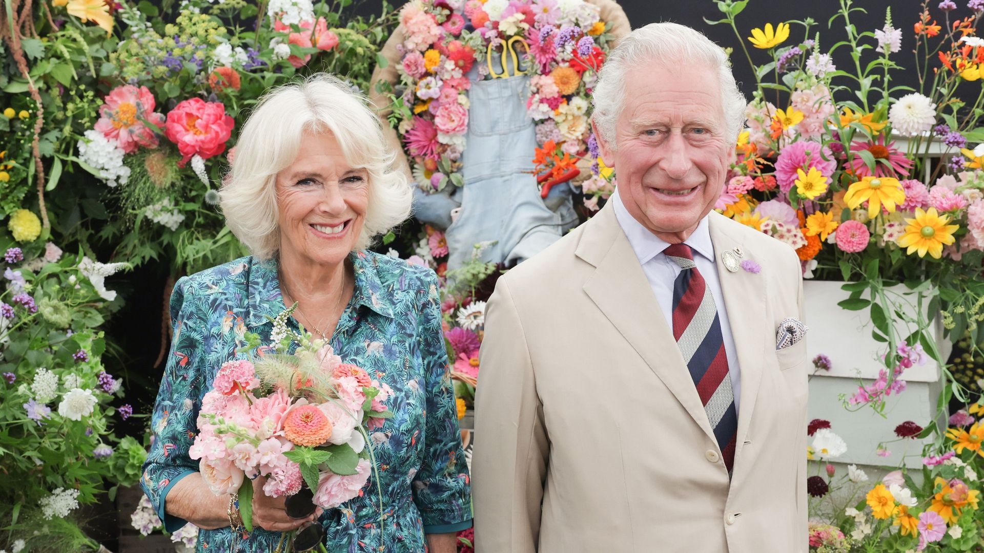 Charles and Camilla surrounded by flowers in Sandringham