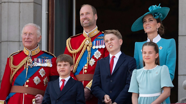 King Charles standing with Prince William, Prince Louis, Prince George, Kate Middleton and Princess Charlotte